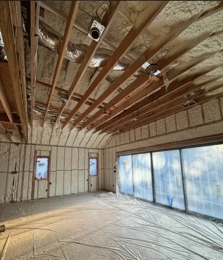 Interior walls and ceiling insulated with spray foam during new construction in Lewiston